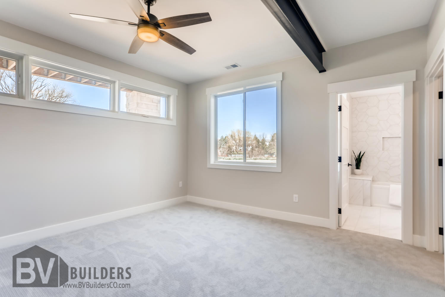 Basement bedroom with exposed steel beam