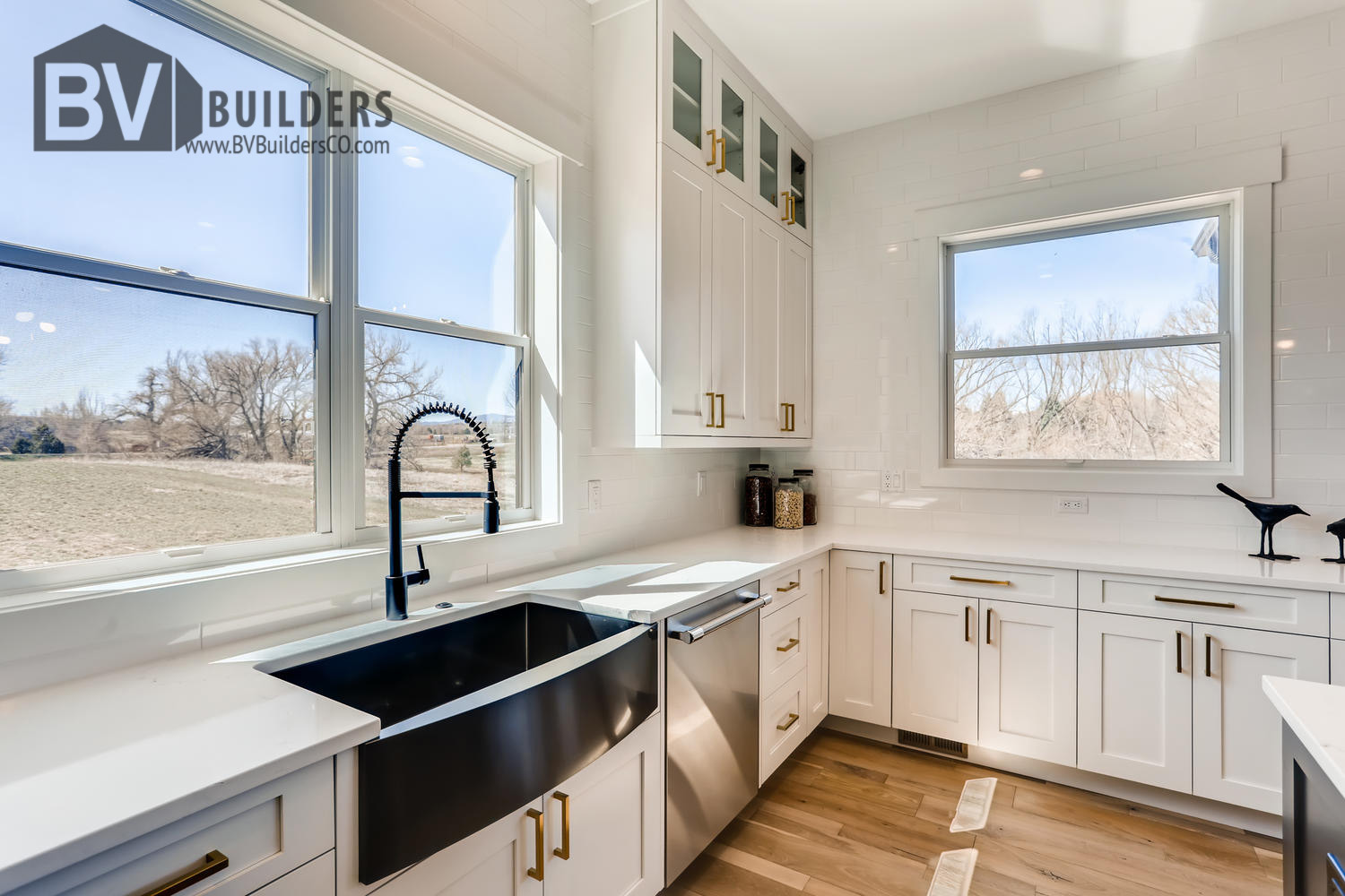 Modern farmhouse kitchen with farm sink and quartz countertops