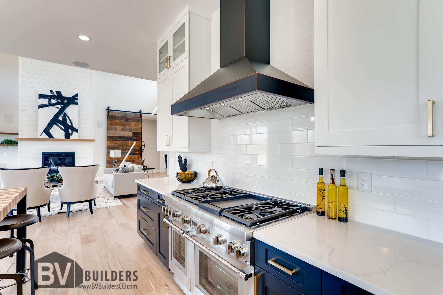 Modern farmhouse kitchen with Thermador range and white subway tile backsplash