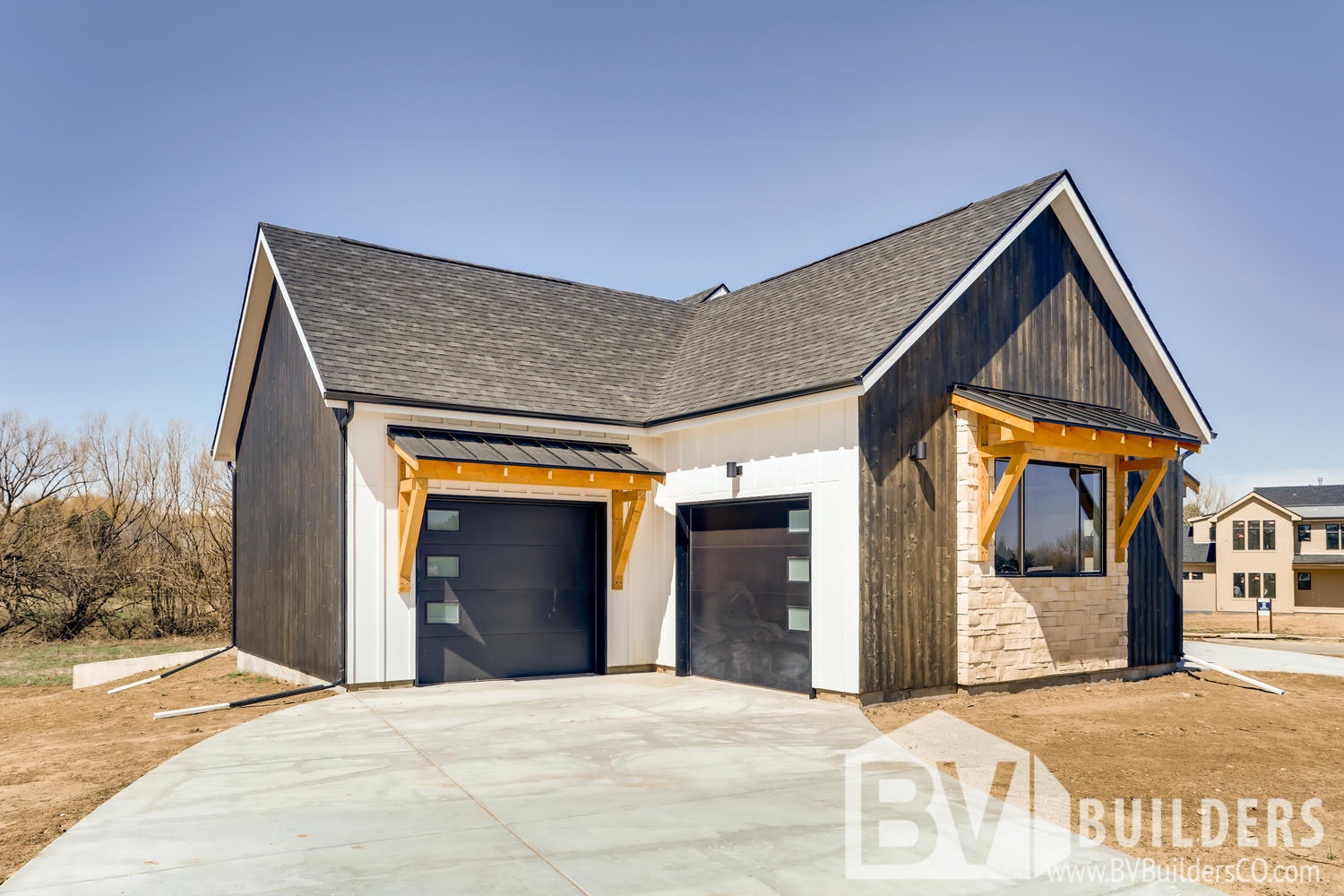 Modern farmhouse with vertical Thermory wood siding